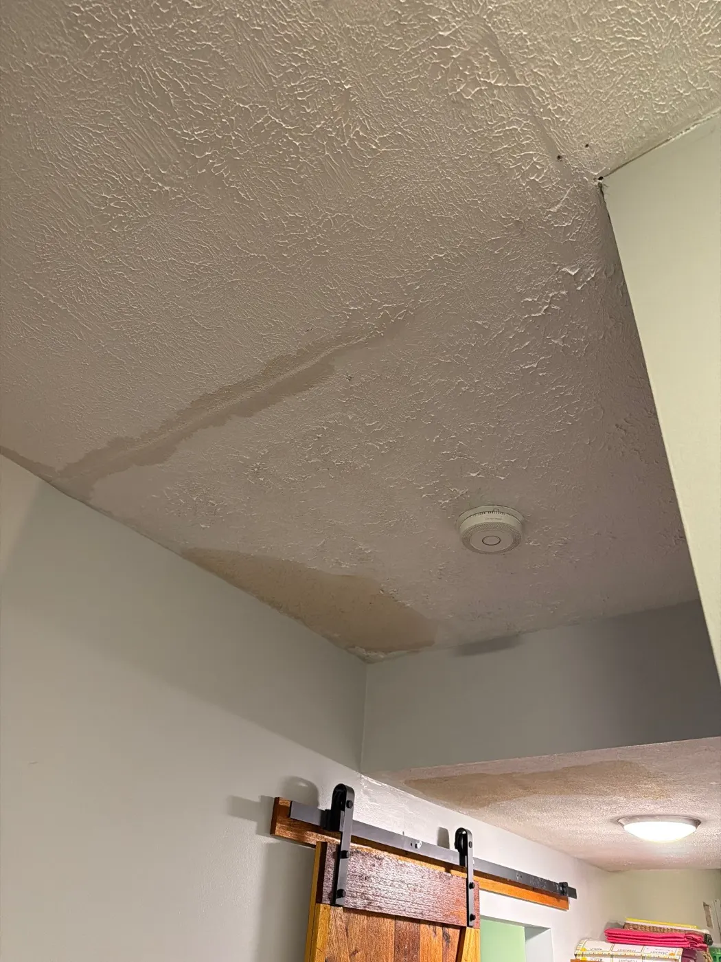 Moisture meter reading on drywall in Long Branch water loss